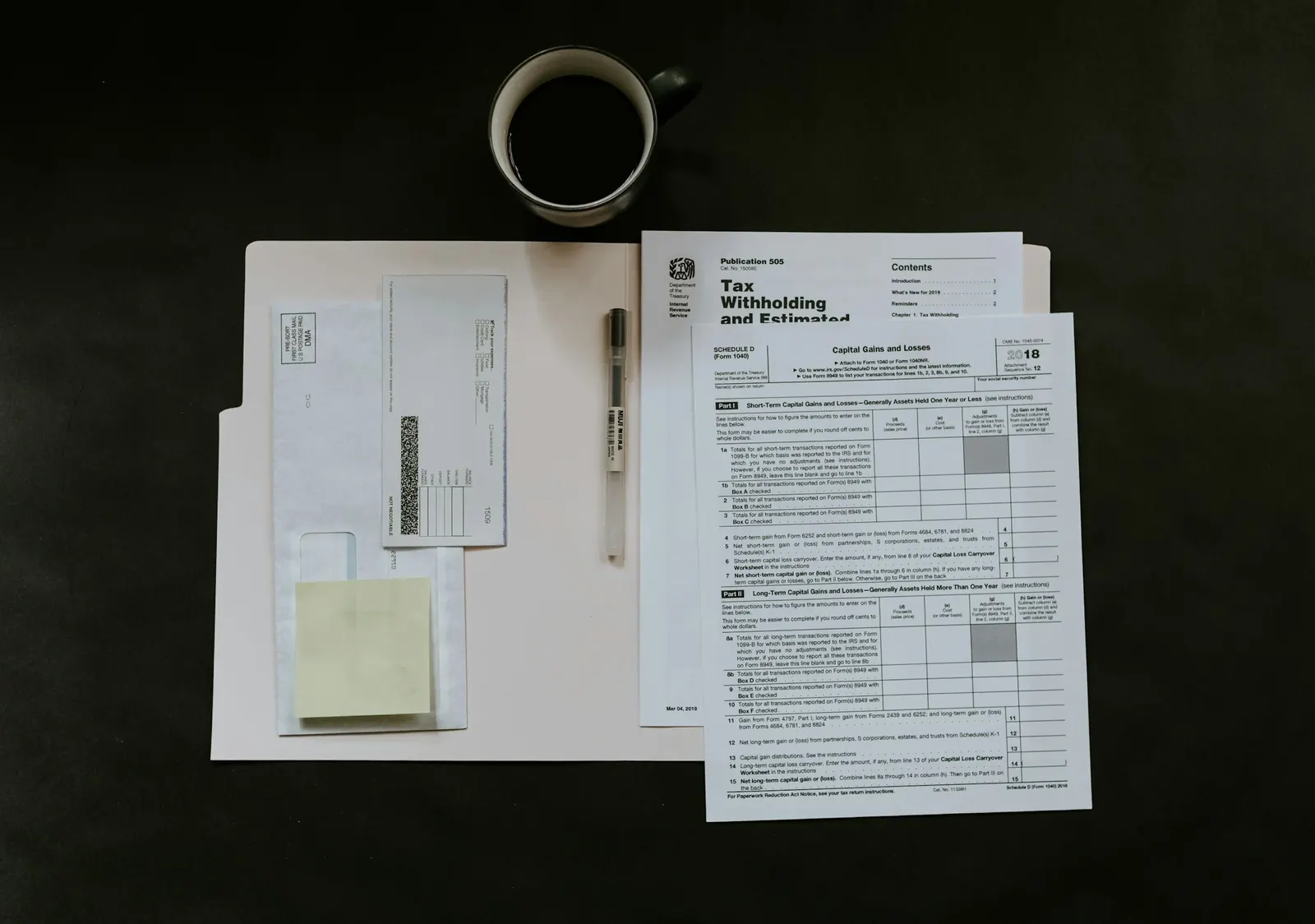 Tax forms and records laid out on a desk